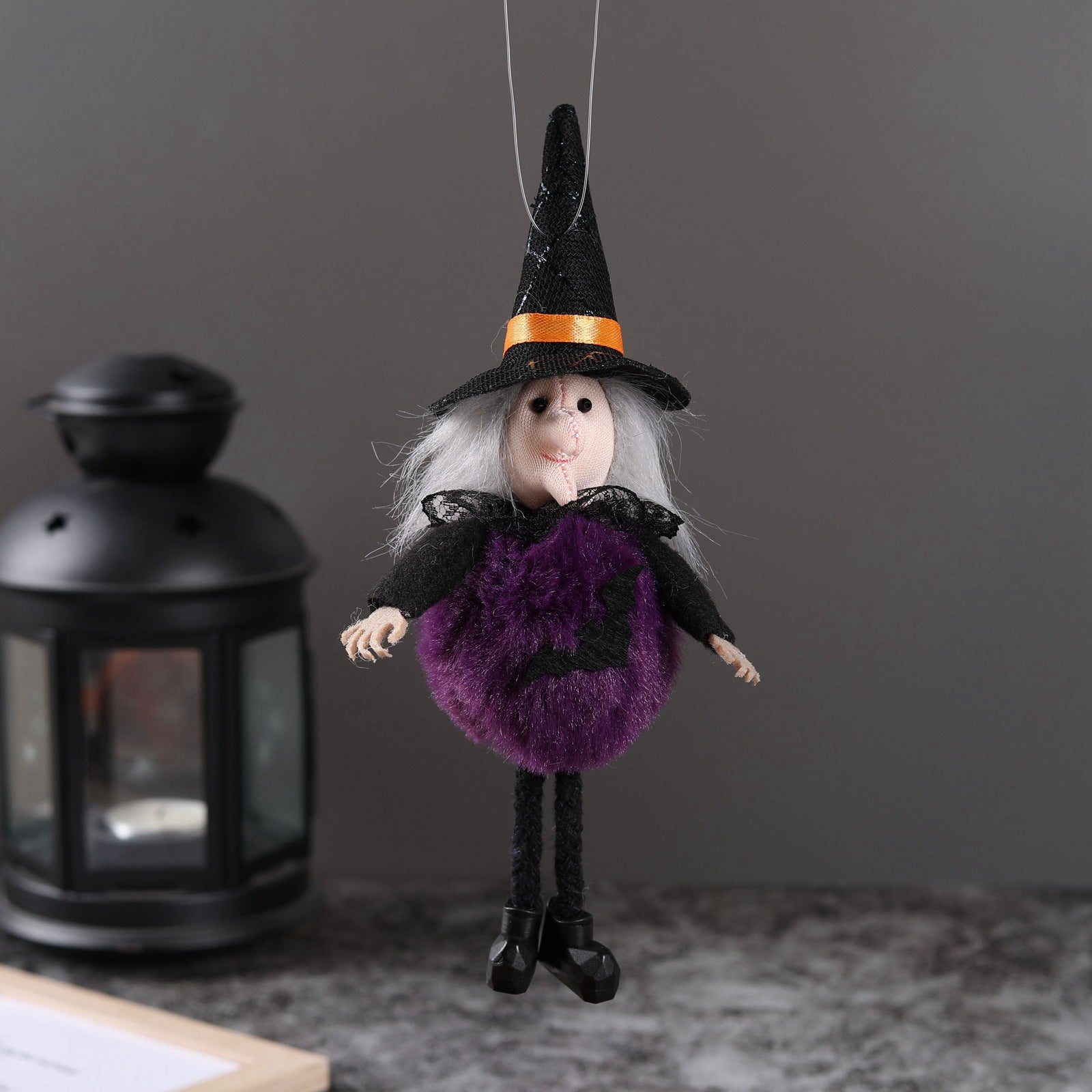 Witch style Halloween hanging pendant in a seasonal display setting