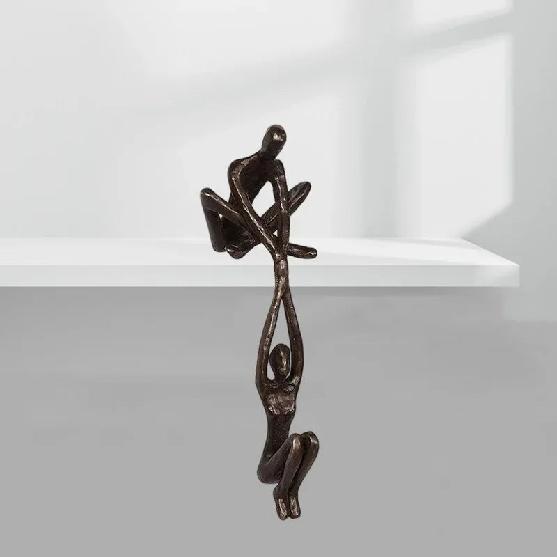 Man lifting woman balance sculpture, bronze-tone resin, additional product view