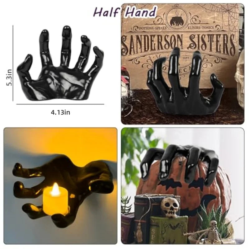 Black skeletal hand holding a candle and gripping a decorative pumpkin