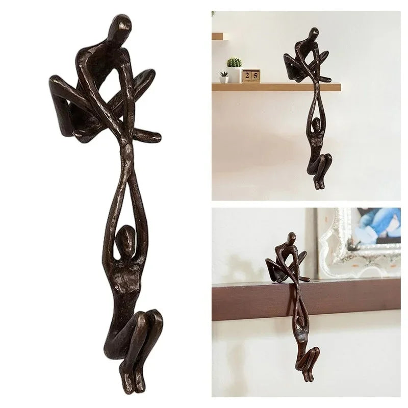 Man lifting woman balance sculpture, bronze-tone resin, additional product view