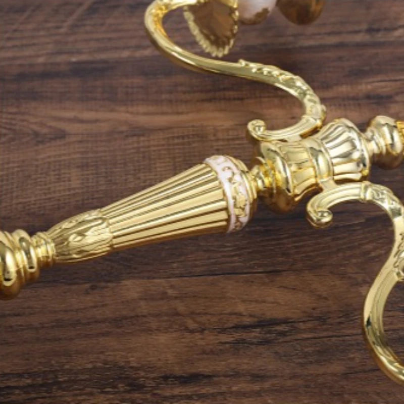 Gold Victorian Cast-Metal Candelabra, close-up of the scrolled arm and floral detail