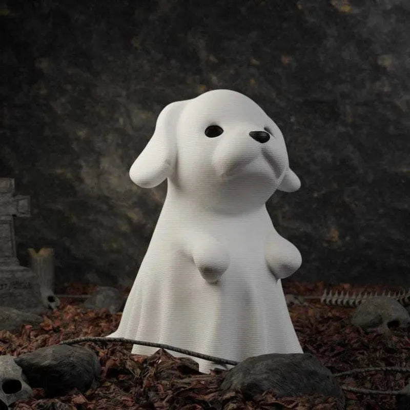 White ghost-shaped dog figurine with raised paws displayed outdoors