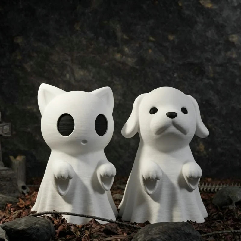 White ghost-shaped cat and dog mini figurines standing together outdoors