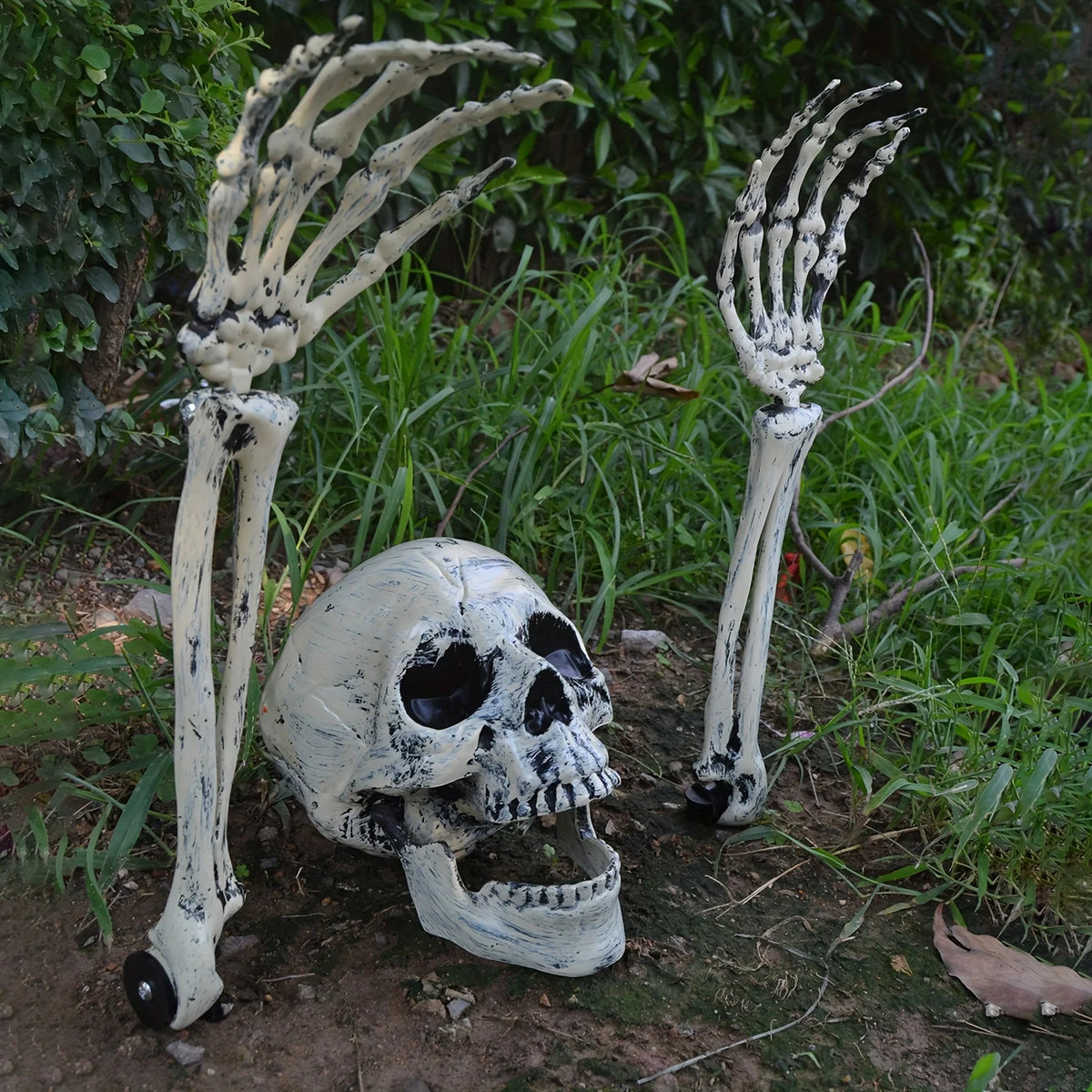 Skeleton hand and skull ground stakes for Halloween yard decor