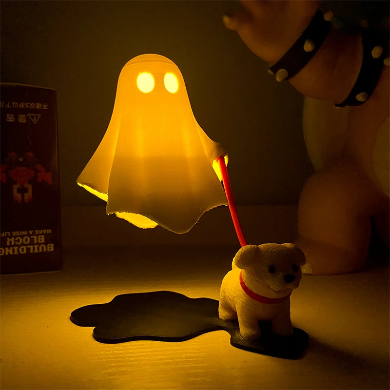 Glowing amber ghost night light walking a leashed puppy figurine at night