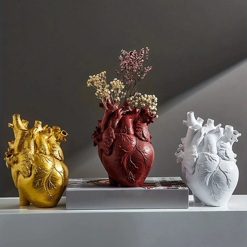 Anatomical Heart Sculptural Resin Vase styled on a tabletop with faux florals