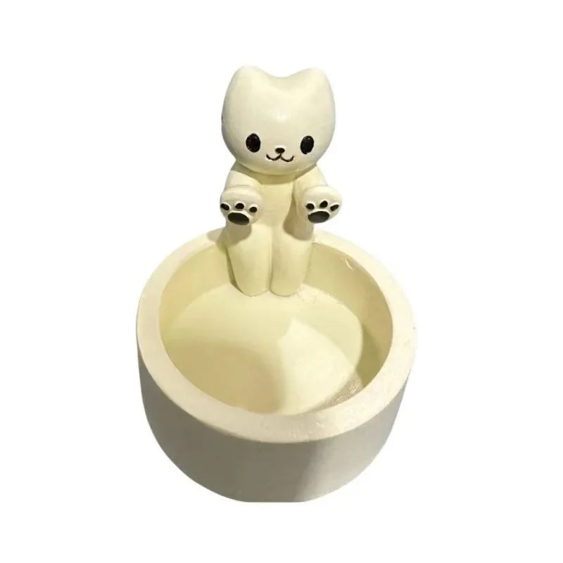 Cat tealight candle holder viewed from the front showing the sitting cat figure