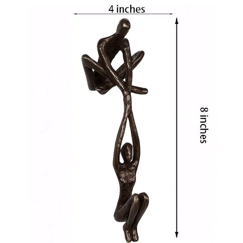 Man lifting woman balance sculpture, bronze-tone resin, additional product view
