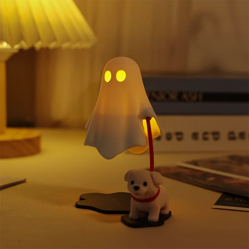 Glowing amber ghost night light walking a leashed puppy beside a lamp and books