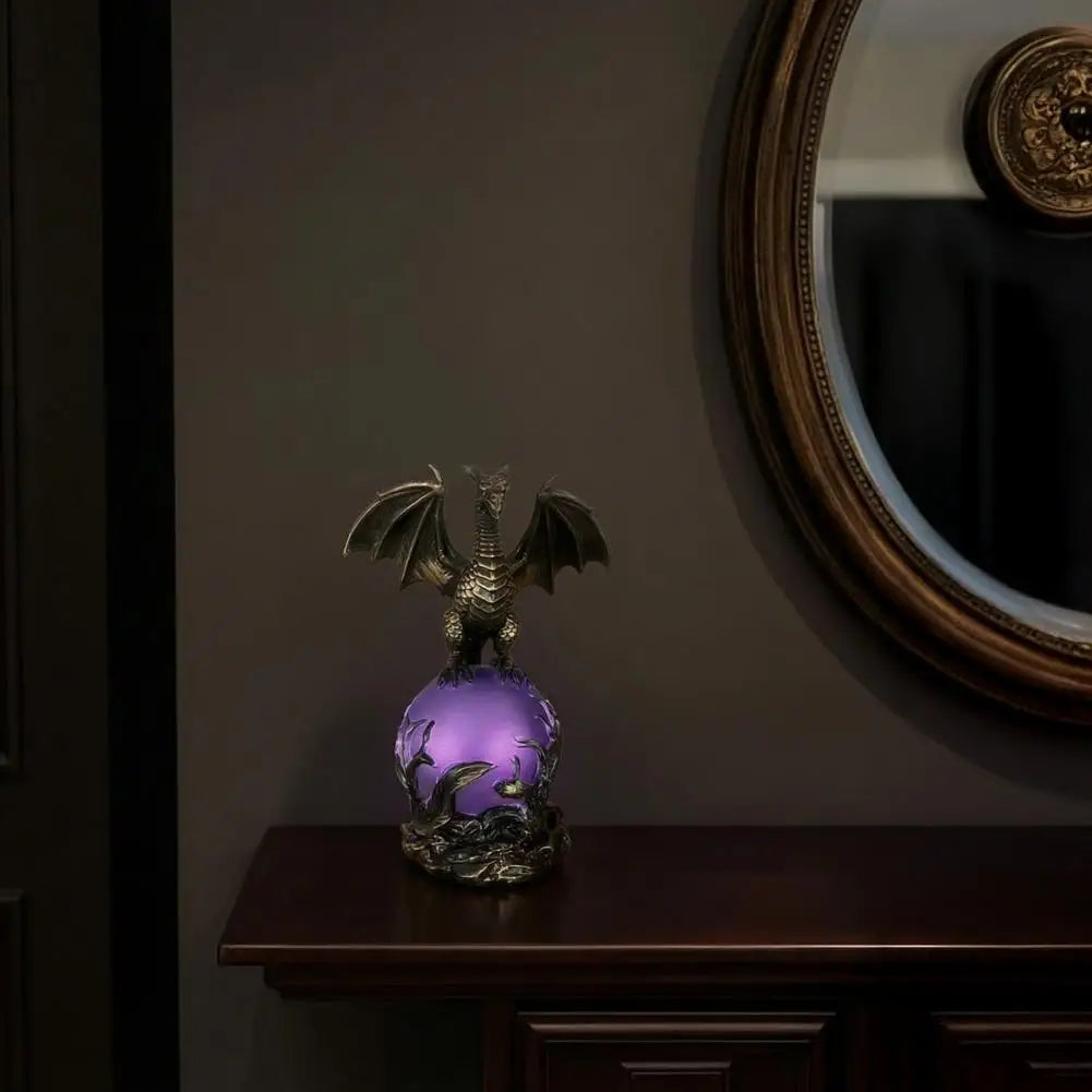 Dragon orb lamp glowing purple on a console table beneath a round mirror